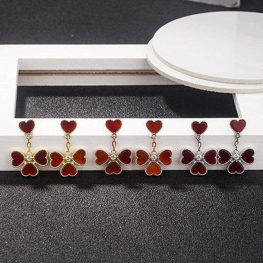 Shell flower drop earrings display, red petals with gold- and silver-tone chains