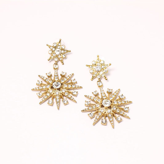 Eight-pointed star stud earrings with clear crystals and gold-tone settings