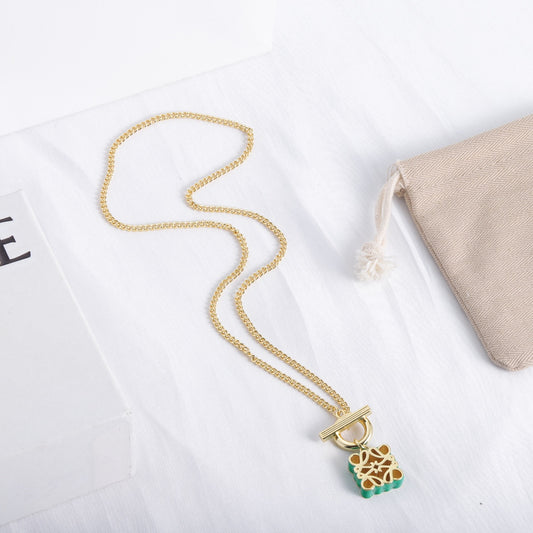 Enamel square cutout logo OT necklace with green enamel square charm and gold chain