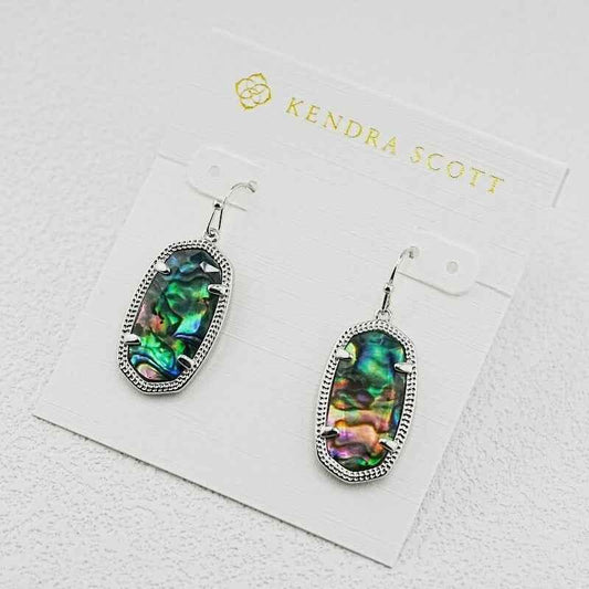 Oval abalone shell dangle earrings with iridescent oval panels and silver-tone border