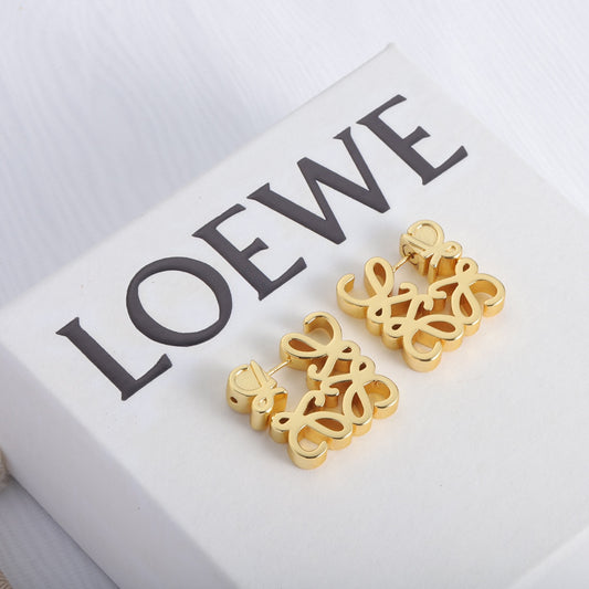 Gold openwork square hoop earrings with ornate swirling cut-out design