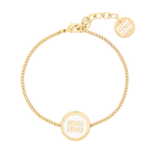 Round enamel bracelet with white center disc, gold-tone curb chain and charm tag