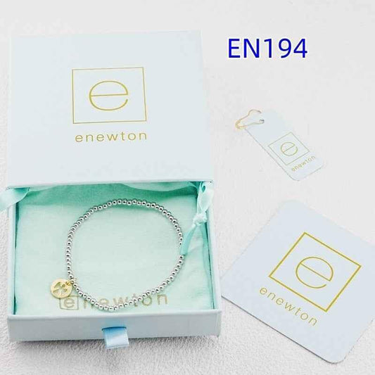 Mixed gold and silver beaded bracelet with gold angel-shaped charm