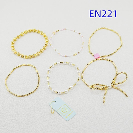 6-teiliges Gold-Perlenarmband-Set: goldene Kugelglieder, weiße Perlen, rosa Schleife