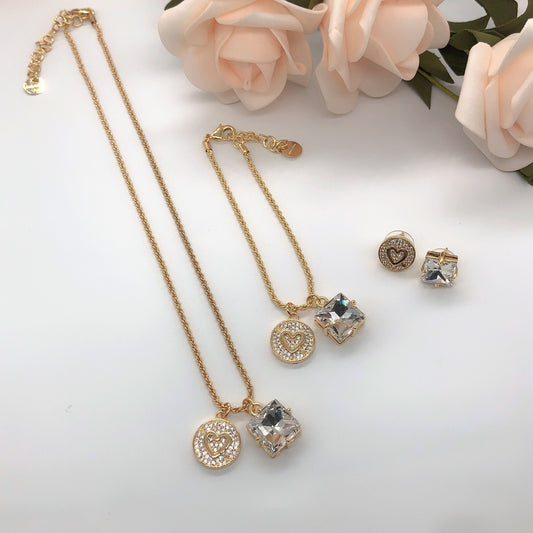 Gold-tone multi-layer necklace with heart round and square crystal pendants