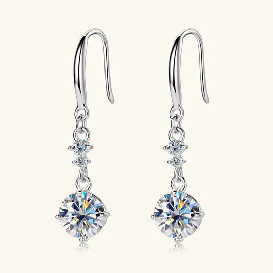 Silver-tone graduated dangle earrings with three round sparkling stones