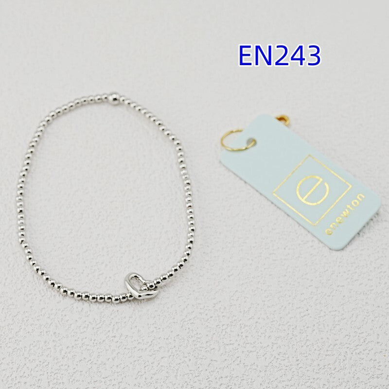 Silver-tone heart-pendant beaded bracelet with heart clasp charm