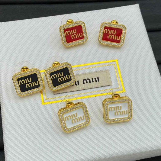 Assorted square stud earrings in gold-tone: red and black enamel with crystal borders