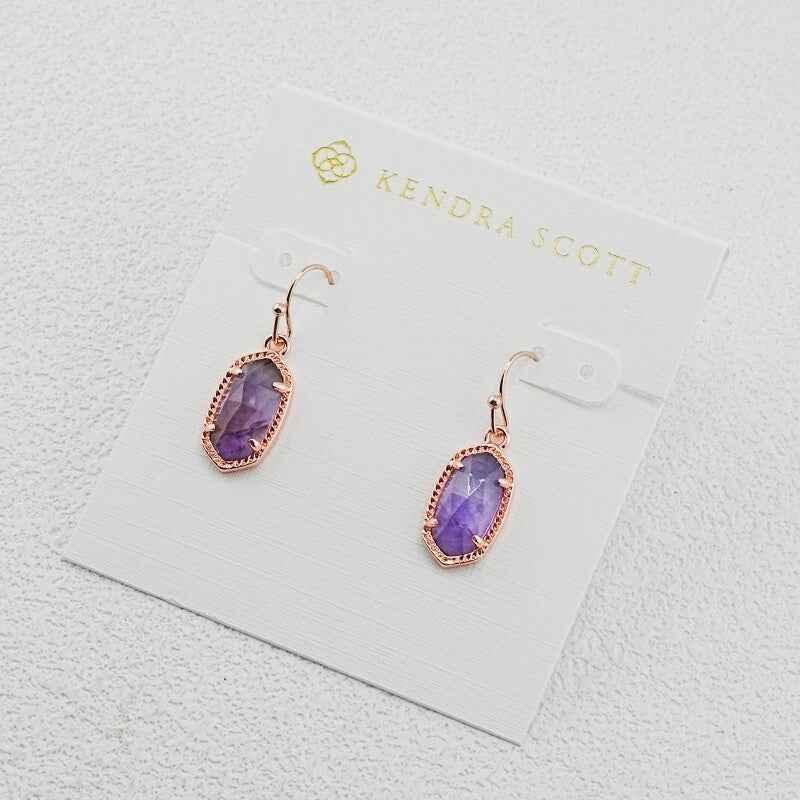 Oval amethyst dangle earrings with rose gold-tone hooks and oval purple stones