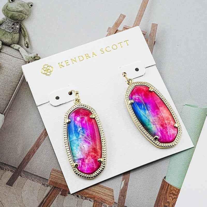 Oval rainbow crystal earrings in gold-tone with ornate edge and dangling hooks