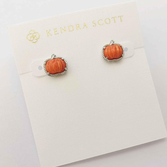 Pumpkin stud earrings with orange center and silver-tone ornate bezel