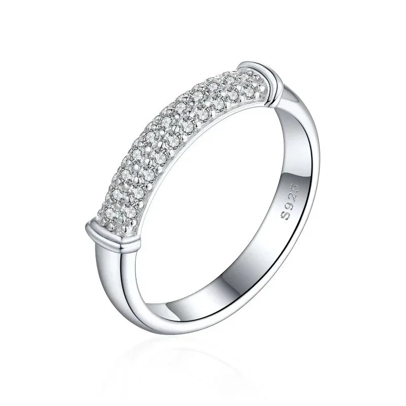 Silver pavé stone ring band with small raised bezels along the outer edge