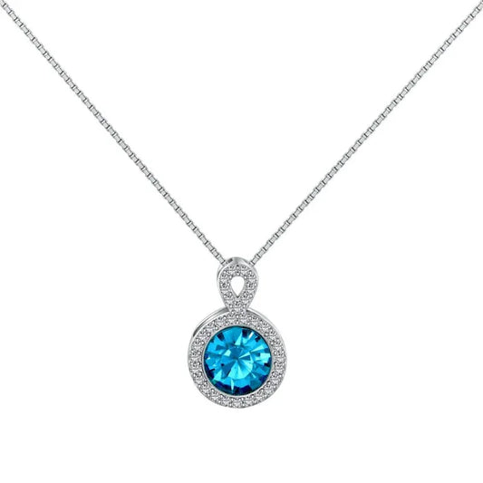 Silver-tone pendant necklace with round blue crystal and halo of clear stones