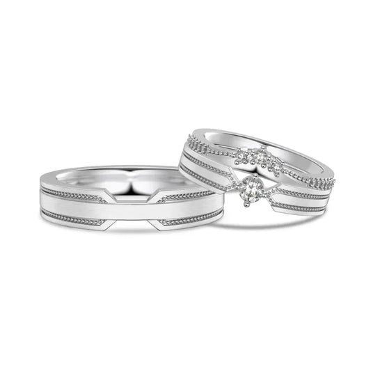 Rhodium silver couple bridal rings, side view, with oval CZ center stones and pavé rows