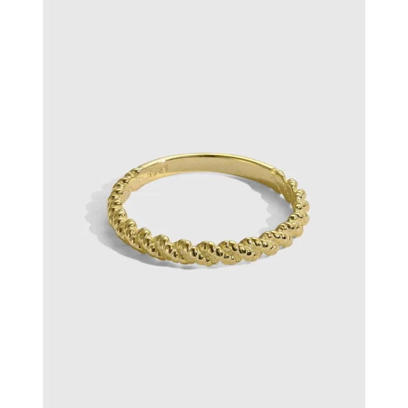 Gold twisted bead band ring with raised bead-like texture