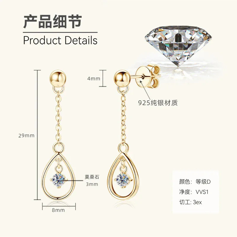 Gold teardrop dangle earrings with round top, chain, and blue center stone