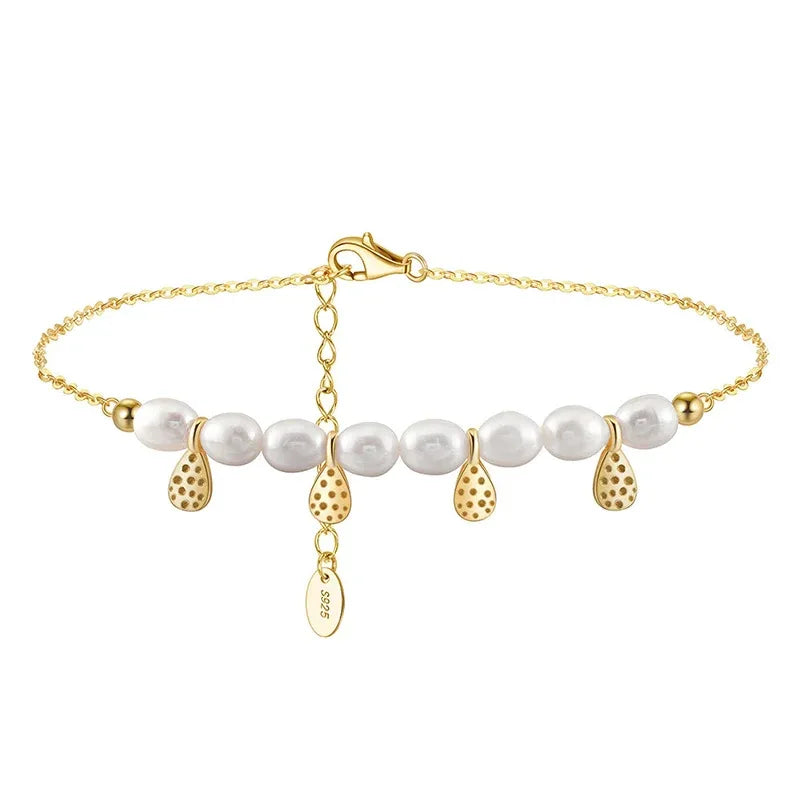 Gold-tone pearl anklet with white pearls, teardrop charms, heart clasp, and S925 tag
