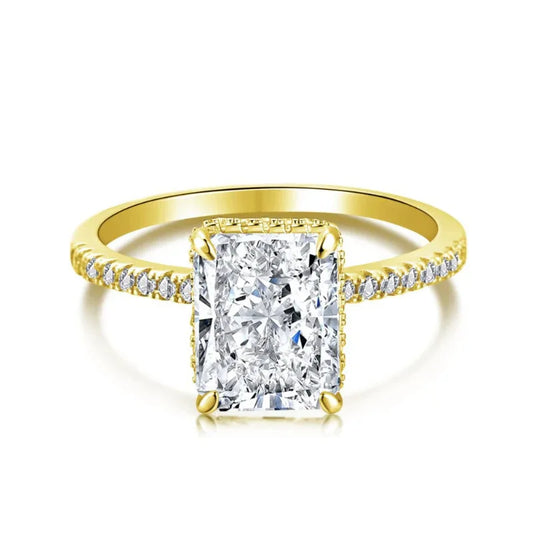 Gold-colored eternity wedding ring with pave band and white square radiant center stone.