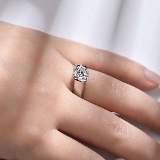 925 sterling silver moissanite ring on finger with small round center stone