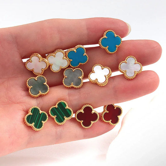Four-leaf clover stud earrings assortment in blue, white, gray, red, and green enamel