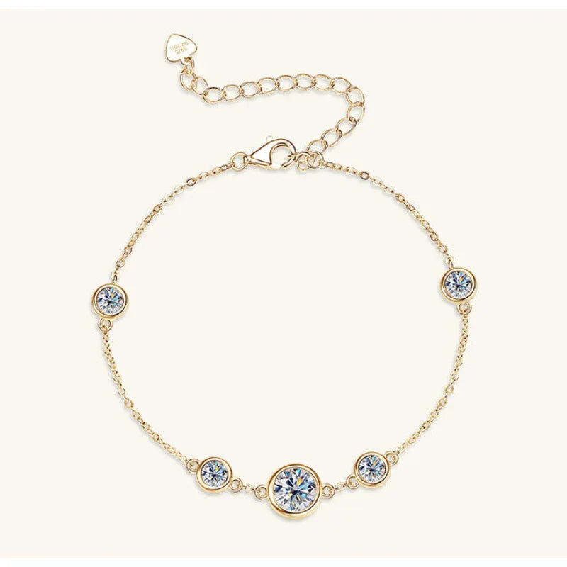 Gold moissanite bracelet with three round bezel-set stones
