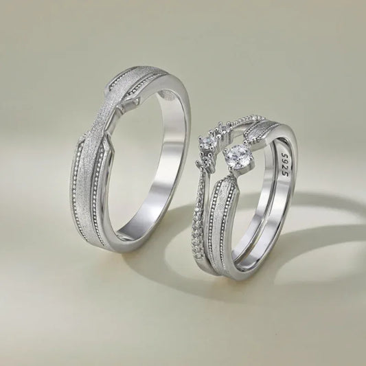 Rhodium silver brushed couple bridal rings with oval CZ center stones and ridged bands