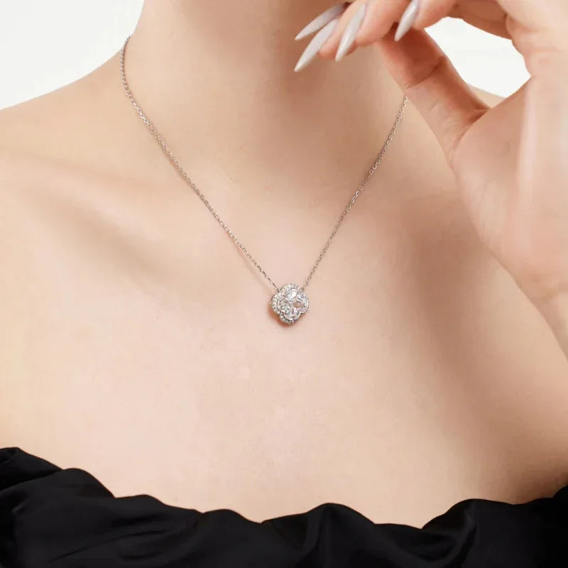 Round halo gemstone pendant necklace with prong-set center stone on silver-toned chain