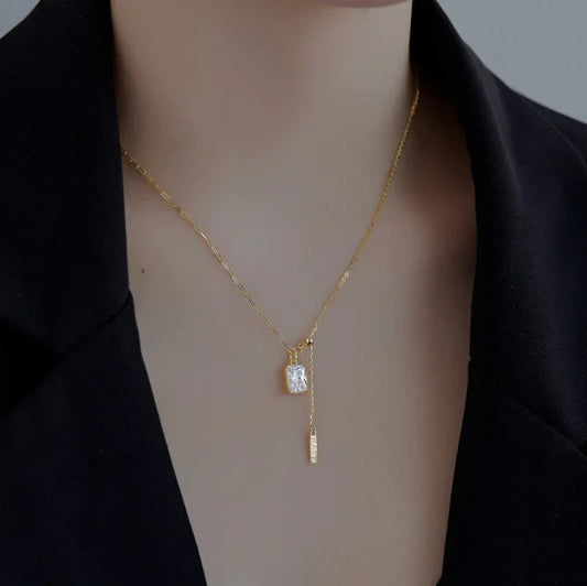 Gold-plated square CZ pendant necklace with small vertical bar charm on a fine chain