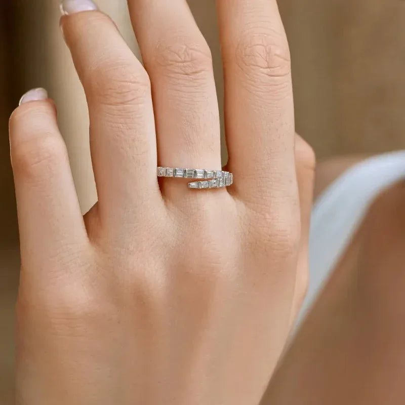 White gold eternity ring with baguette CZ stones and twisted band
