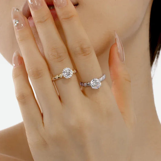 Gold and silver croissant eternity band rings with round CZ stones on fingers