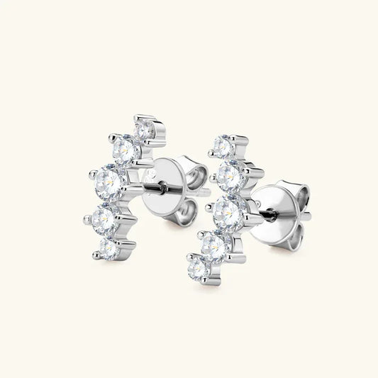 Silver-tone cluster stud earrings with five round stones arranged vertically in a chain