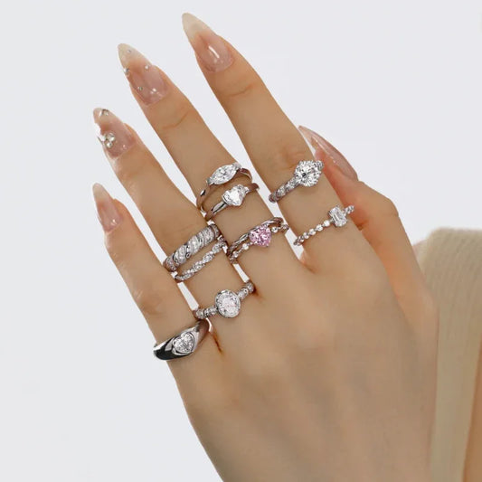 Sterling silver ring stack featuring an emerald-cut center CZ eternity band and round CZ accents