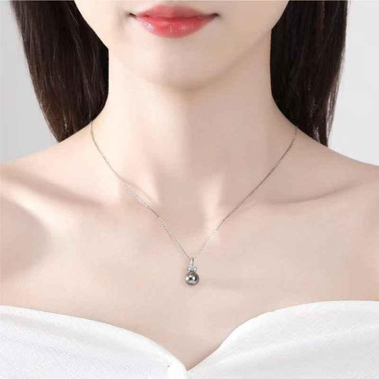 Silver tone pendant necklace with dark gray pearl and small diamond cluster