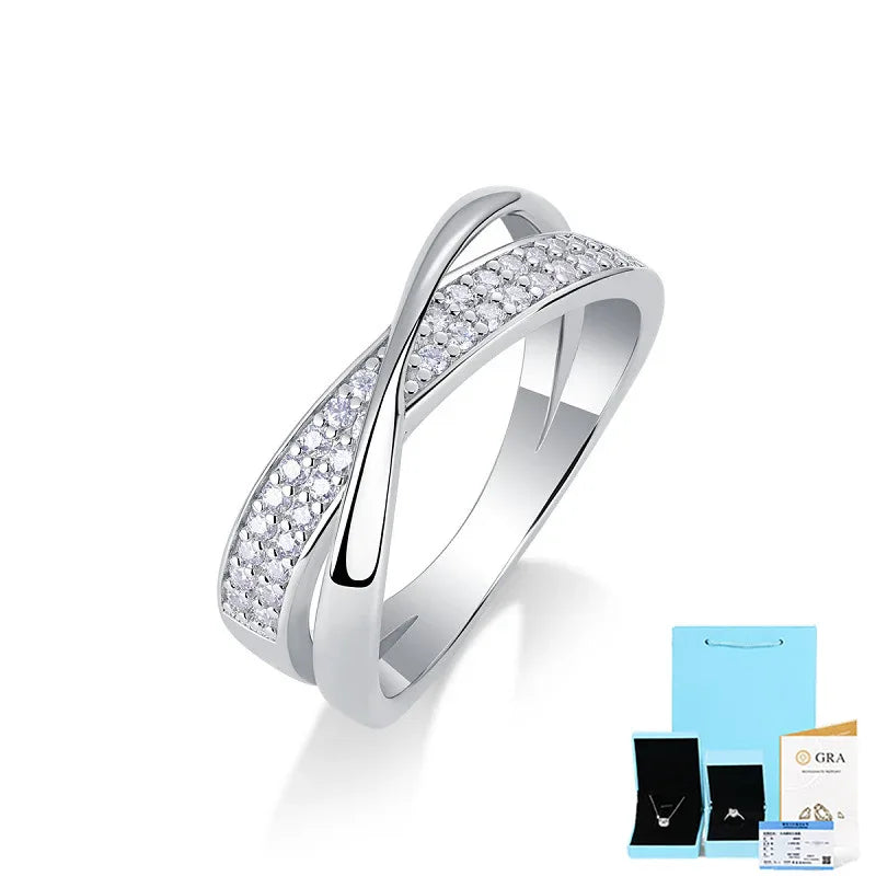 White gold full pavé moissanite wedding ring with bright round stones on a curved bezel.