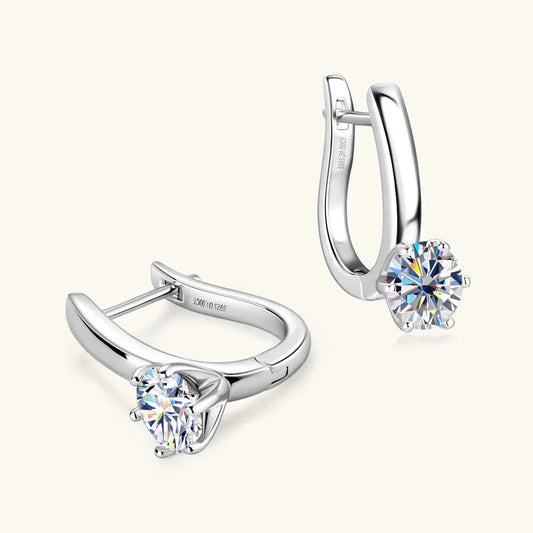 Silver-tone huggie hoop earrings with clear round moissanite solitaire, leverback