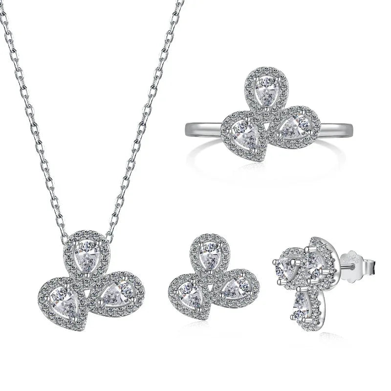 Silver CZ jewelry set with clear stones: pendant necklace, ring, and stud earrings