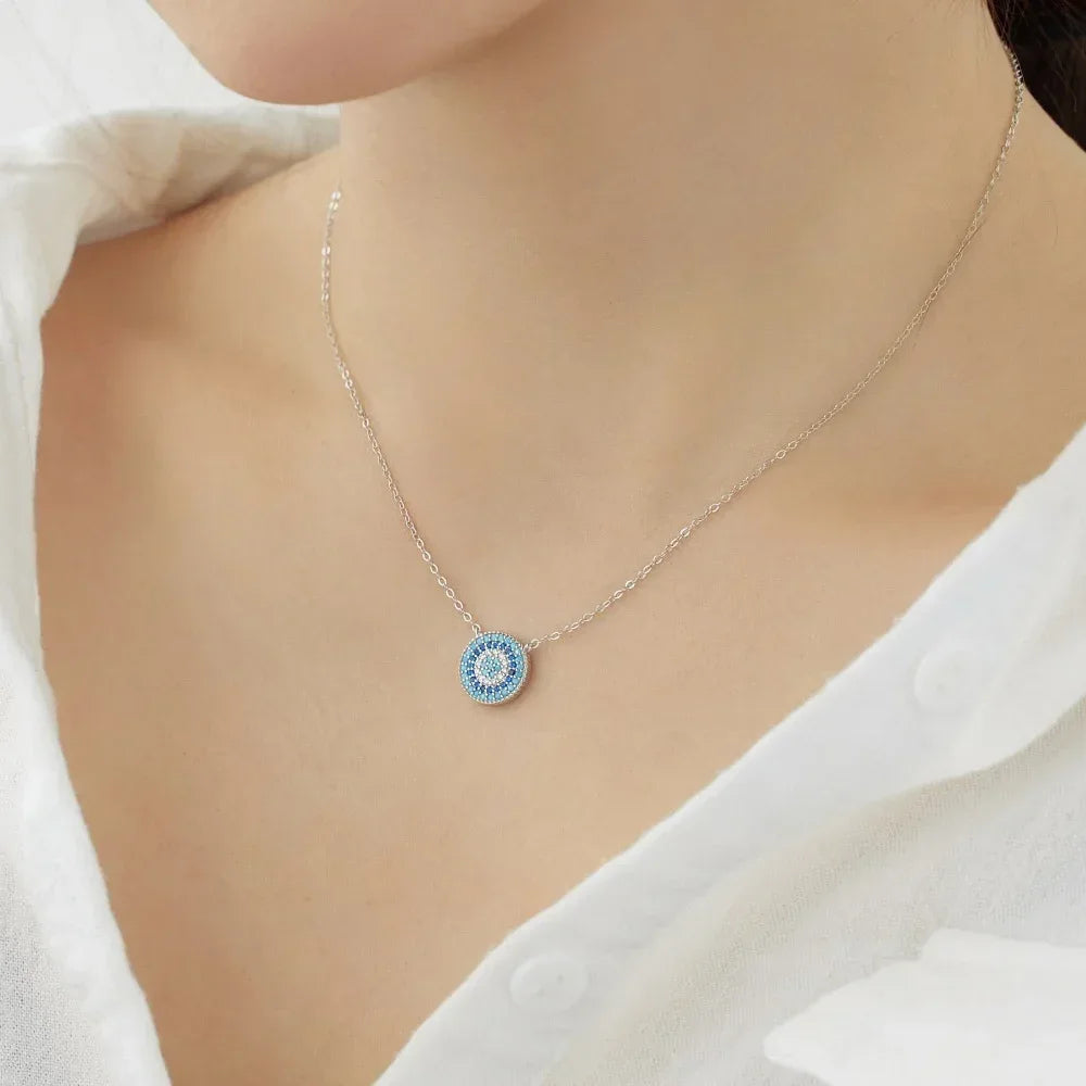 Silver-tone evil eye pendant necklace with blue CZ pave round charm