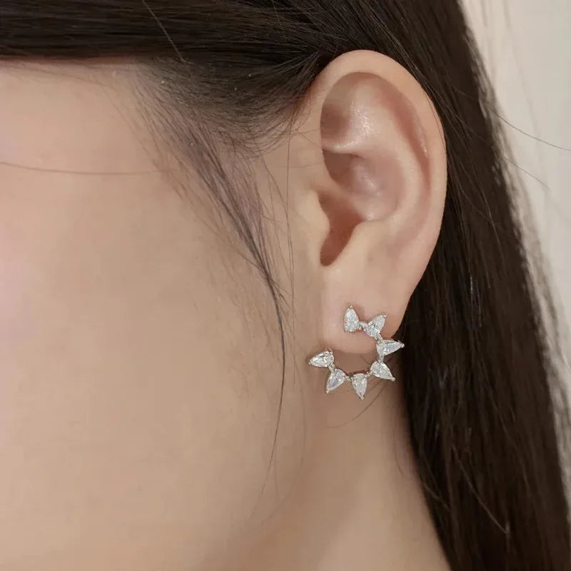 Silver-tone marquise-stone flower stud earrings, five-stone cluster on ear