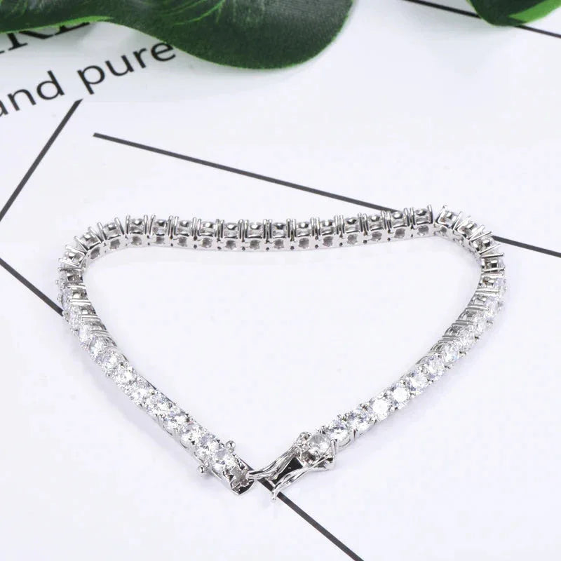 White gold tennis bracelet with continuous CZ sparkle and hinged bar clasp
