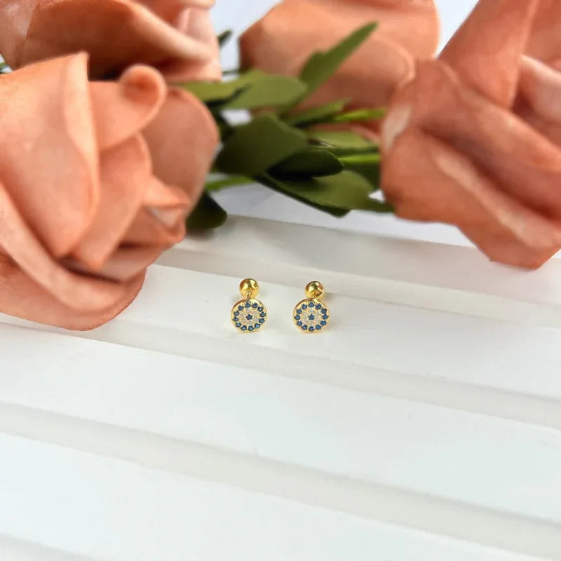 Gold-tone round evil eye stud earrings with blue and clear stones, pair view.