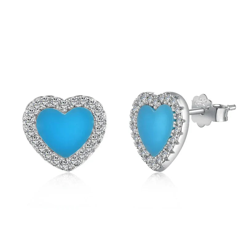 Heart stud earrings with blue enamel center and diamond halo, silver-tone setting