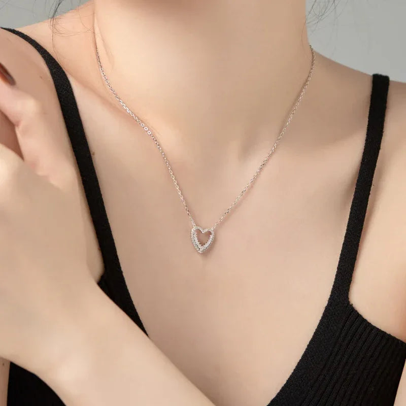Silver-tone heart pendant necklace with pavé CZ heart, close to collar