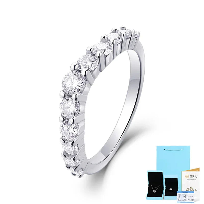 Silver moissanite diamond ring with round stones in a curved, full-band design