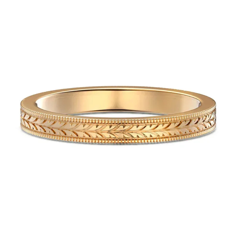Champagne gold-tone ring band with leaf engraving texture along the side