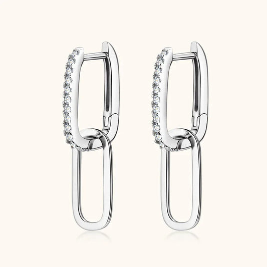 Silver-tone geometric link hoop earrings with pavé stones along the top bar and outer frame