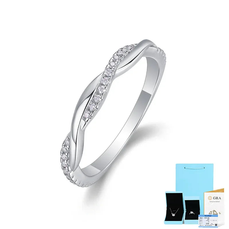 Silver moissanite engagement ring with round stones set across the front and side