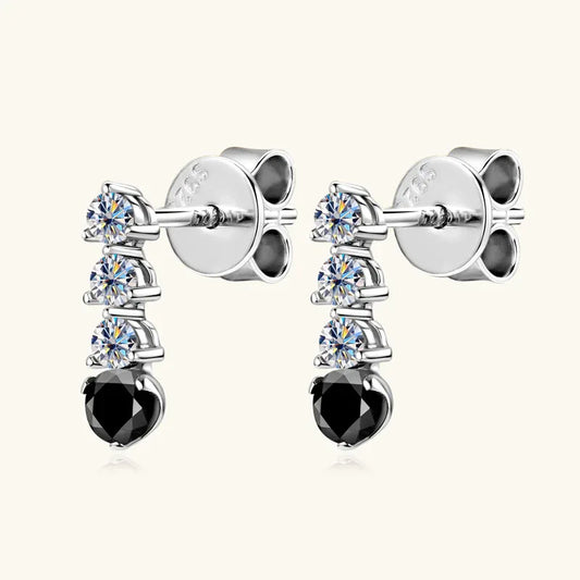 Silver-tone cascading earrings with three round moissanite and a black oval drop