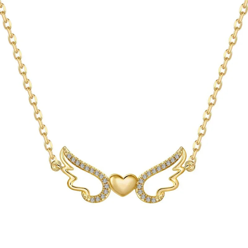 Gold heart wing pendant necklace with CZ sparkle stones and linked chain.