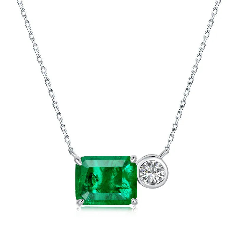 Green square CZ pendant necklace with round white CZ side stone on silver chain