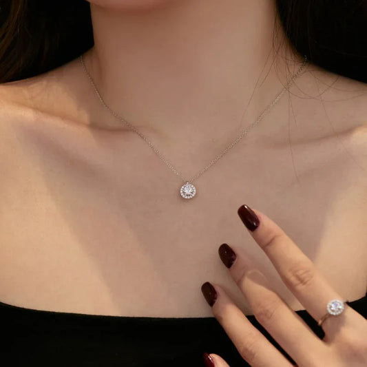 Rhodium-plated CZ necklace with small round pendant and matching ring